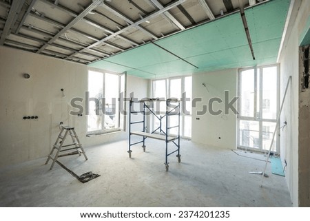 Drywall installation work in progress by construction workers at construction room. easiest and cheapest way to do partition for interior wall. New home for under construction. protection building 