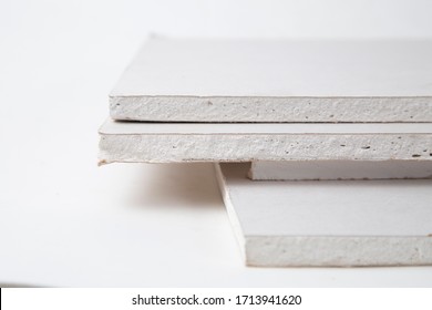 Drywall On A White Background. Construction Material For Repairs.