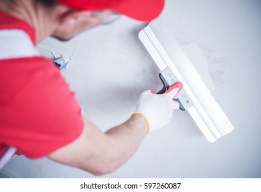 Drywall Patch By Construction Worker. Closeup Photo.