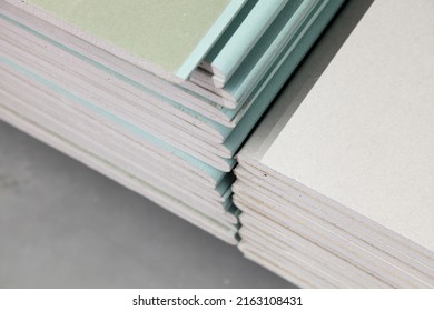 Drywall Sheets In Stack Close Up - Modern Construction Materials