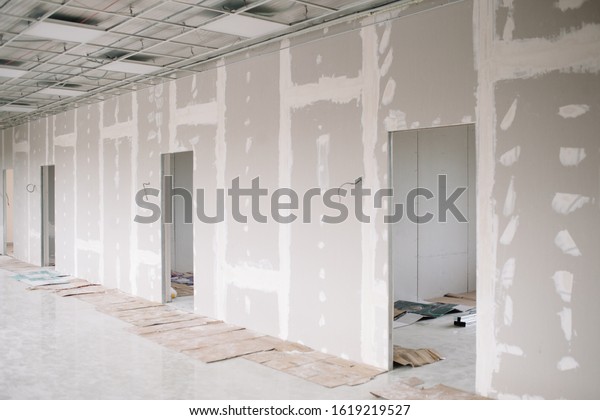 Drywall wall home interior decoration at\
construction site with copy space add\
text