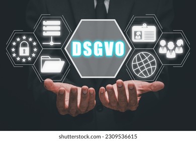 DSGVO Basic Data Protection Regulation Concept, Person hand holding DSGVO icon on virtual screen.