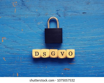 DSGVO concept image with small wooden dices on a wooden background