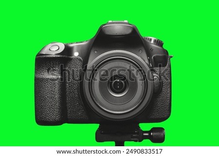 DSLR Camera front view on Green background