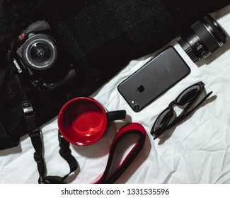 DSLR Camera Iphone Camera Lens Glasses On White And Black Background Baton Rouge, Louisiana, USA - February 13 2019