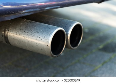 dual exhaust of a car, concept for emissions and particulate matter or environmentally friendly vehicles