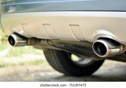 Dual Exhaust Pipes Of Modern Diesel Engine Car. Detail Of Extended Chromium Exhaust Pipes End.