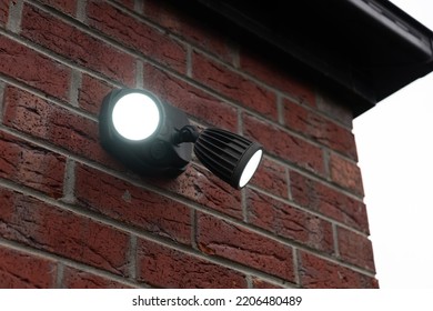 A Dual Head Flood Light Mounted On The Wall.