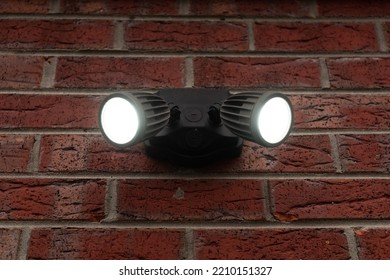 A Dual Head Flood Light Mounted On The Wall.