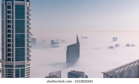 Dubai Aerial view showing fog over al barsha heights and greens district area timelapse from Dubai marina. Towers and skyscrapers foggy morning from above - Shutterstock ID 2152820343