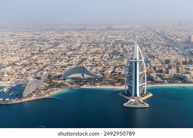 Dubai Burj Al Arab luxury hotel at sea aerial view photography from above in United Arab Emirates - Powered by Shutterstock