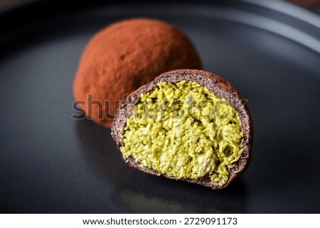 The Dubai Chewy Cookie split open, showing a rich pistachio and kataifi filling.