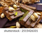 Dubai Chocolate bar with green kadayif and pistachio spread with pistachio nuts close up