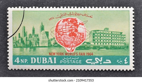 Dubai - circa 1964 : Cancelled postage stamp printed by Dubai, that shows Unisphere over Manhattan and Dubai, World's Fair 1964-1965, New York, circa 1964.