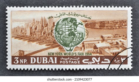 Dubai - circa 1964 : Cancelled postage stamp printed by Dubai, that shows Unisphere over District of New York and exhibition, World's Fair 1964-1965, New York, circa 1964.