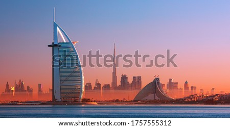 Dubai city - amazing city center skyline and famous Jumeirah beach at sunset, United Arab Emirates