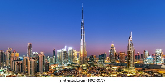 Dubai - city center skyline and bussy evening after sunset with colorful sky, United Arab Emirates