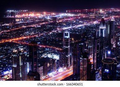 Dubai city at night, UAE, beautiful bird eye view on glowing downtown, panoramic cityscape, luxury Arabic buildings, travel and tourism concept