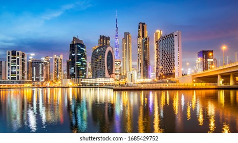 Dubai city skyline panorama at sunset, UAE marina travel photo. Dubai Business Bay skyline.