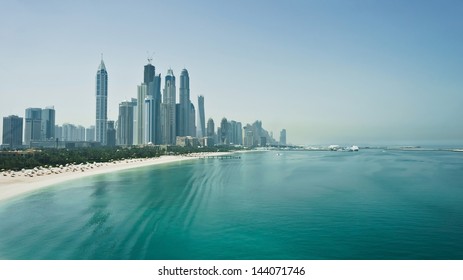 Dubai city skyline with skyscrapers, sea and beach. Travel, tourism, cityscape or business concept. Fastest growing city in the world. United Arab Emirates. High quality image - Shutterstock ID 144071746