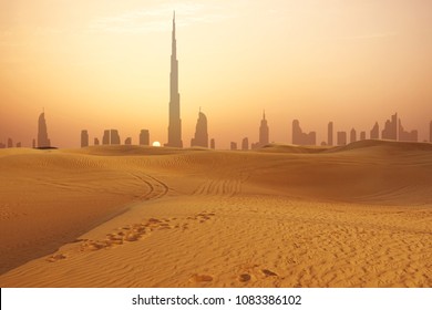 Dubai city skyline at sunset seen from the desert
				