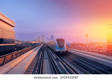 Dubai cityscape, modern metro railway with skyscrapers, sunset. Traffic train and building with urban skyline background of city UAE. - Powered by Shutterstock