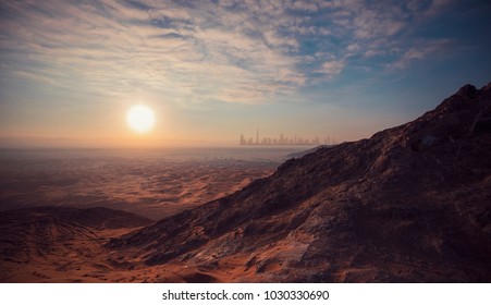 Dubai Desert Mountain Sunrise - mountains are silhouetted in this dramatic hatta sunrise.  - Powered by Shutterstock