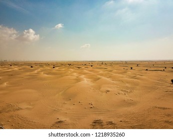Dubai desert roads being covered in sand from the desert - Shutterstock ID 1218935260