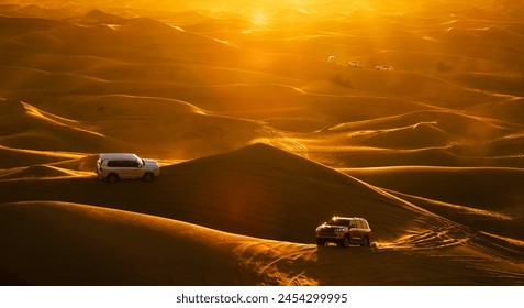 Dubai desert safari in sunset light. Off road safari in sand desert, Empty Quarter Desert in United Arab Emirates. Offroaders on dunes in Rub’ al Khali desert. - Powered by Shutterstock