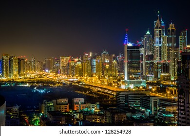 Dubai Downtown Night Scene With City Lights, Luxury New High Tech Town In Middle East, United Arab Emirates Architecture