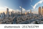 Dubai Downtown skyline with Burj Khalifa and other towers panoramic view from top in Dubai, United Arab Emirates. Traditional and modern buildings. Traffic on circle road and fountains after sunset