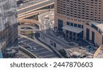 Dubai downtown street with busy traffic and skyscrapers around timelapse. Modern road and urban buildings with mall aerial view. Sheikh Mohammed bin Rashid Blvd