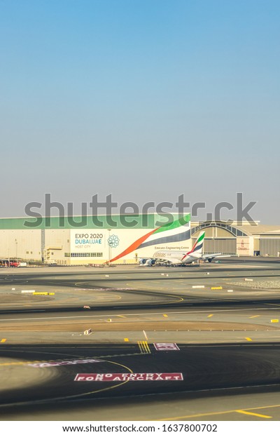 Dubai, Emirates - 18\
November 2018: Emirates plane hangar at airport at Dubai with EXPO\
2020 DUBAI UAE
