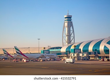 Dubai - February 20:  Planes preparing for take off at Dubai Airport on February 20, 2016 in Dubai, U.A.E. Dubai airport is home port for Emirates Airlines and one of the biggest world hubs.