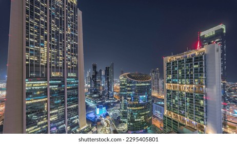 Dubai international financial center skyscrapers and promenade on a gate avenue aerial night . Illuminated towers ultra wide angle view from above - Powered by Shutterstock