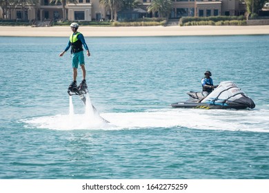 Dubai January 2020. Water Extreme Sport. The Guy Is Flying At The Aquatic Flyboard. Extreme Rest On The Sea