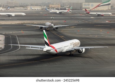 DUBAI - JANUARY 9: An Emirates Plane Is Taxing For Take Off As Seen On January 9, 2015. Dubai Airport's Traffic Is Very Heavy In The Mornings As Can Be See Here Planes Are Queuing Up For Departure.