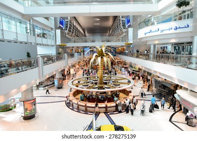 DUBAI - MARCH 10, 2015: Dubai duty-free shopping area interior. Dubai International Airport is the primary airport serving Dubai and is the world's busiest airport by international passenger traffic