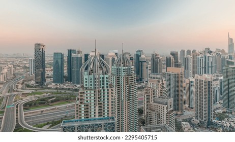 Dubai marina and JLT skyscrapers along Sheikh Zayed Road aerial  during sunset. Residential and office buildings from above.