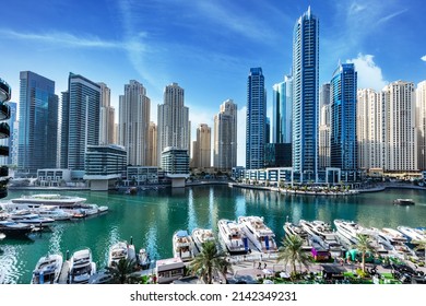 Dubai marina promenade in UAE. Highrise residential buildings, business skyscrapers - Shutterstock ID 2142349231