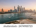 Dubai Marina Skyline and Luxury boats and yachts moving in Sea of Dubai Marina 