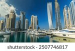 Dubai Marina tallest modern towers and floating yachts and boats timelapse hyperlapse from promenade walking area, United Arab Emirates.