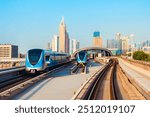 Dubai metro trains and Dubai city skyline in UAE