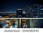 Dubai Multi Commodities Centre and the city around it at night