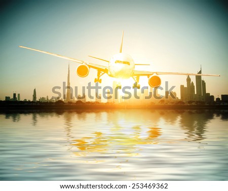 Dubai. plane flies on the background of a beautiful beach and sea. United Arab Emirates.