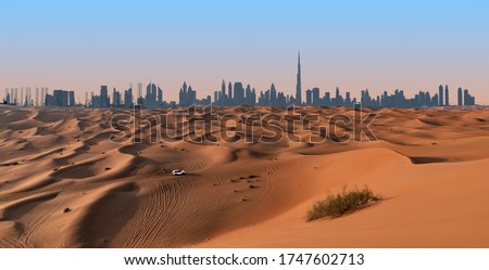 Dubai skyline and desert landscape.