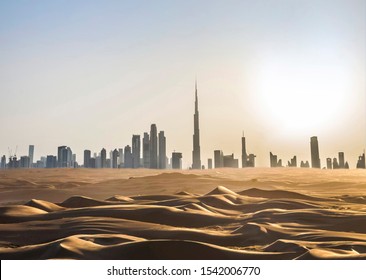 Dubai skyline in the desert at sunset. United Arab Emirates.