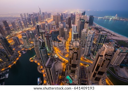 Dubai skyline, skyscrapers. Dubai Marina from above. Morning light. Dubai citylights. Luxury homes, private property. Cayan tower view.