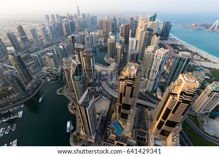 Dubai skyline, skyscrapers. Dubai Marina from above. Morning light. Dubai morning. Cayan tower view. Luxury homes, private property.