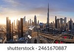 Dubai skyline at sunset with traffic - aerial view, United Arab Emirates